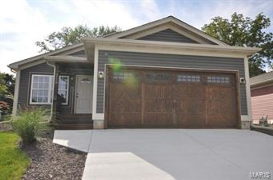 Adorable 2 bed 2 bath ranch loaded with updates and options including the vaulted great room, 42' dark maple cabinetry, 1/2 inch hickory wood flooring, MFL, 2 panel doors, upgraded vanity, open stair case to finished lower level with family room, rec room, office area, bath and lookout window with walk up ladder, Oversized one car garage, nice deck and yard with privacy fencing.