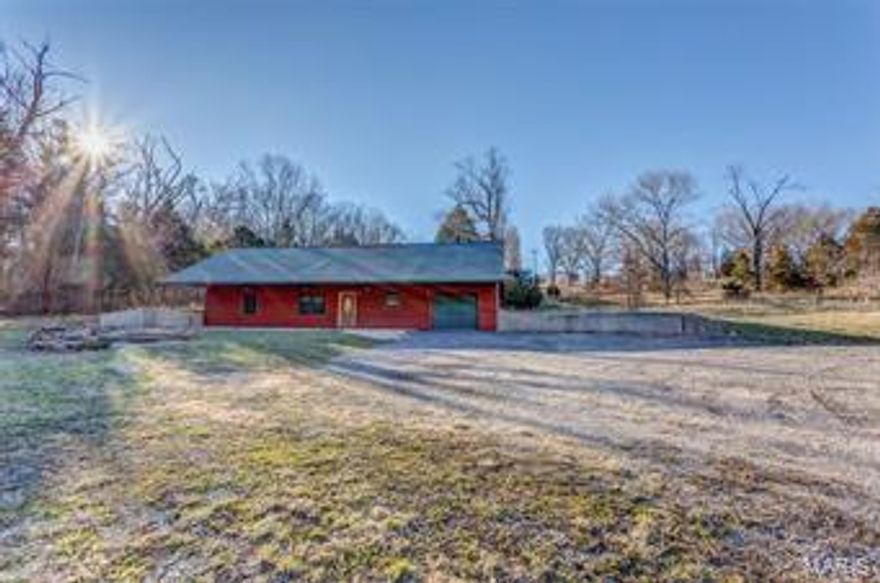 This cute ranch style home is just 3 miles from town sitting on almost 2 acres +/-! Walking into the  home you have a warm rustic feel with an open concept home! Beautiful wood ceiling!! The kitchen is large with lots of space! There are 3 Bedrooms and 2 bathrooms! The Master Suite has a HUGE bathroom! The bathroom in includes a tile walk in shower, separate (relaxing) jetted tub with a beautiful vanity!! The bedrooms are large! This home has so much to offer you! Call today to set up your private tour!