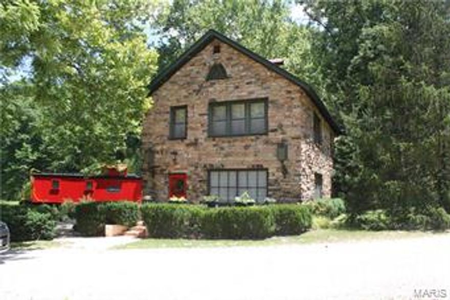 As you approach this marvelous glen of paradise, you will feel yourself relax. The canopy of trees and playful sunlight dancing around will have you falling in love with Section 4! The main house has arched doorways and stone, you will wonder if you have been transported back in time. The upper floor has a large bedroom and master bath, marble rain shower was recently completed. There is a 1 1/2 story log cabin with a bedroom downstairs and another one upstairs. A renovated caboose is available for your guests. There is also a 2 bedroom caretakers cabin with basement.  18 running springs are on this property 1 near the main house with its own spring house. Beautiful landscaping, perennial gardens and a patio to enjoy the beauty of your surroundings. A 72x150 Riding Arena complete with stalls that include a bathing, foaling, and tack room. Amount of pasture versus wooded is approximate. There are so many things to enjoy that you will get lost in the wilderness of your own backyard!