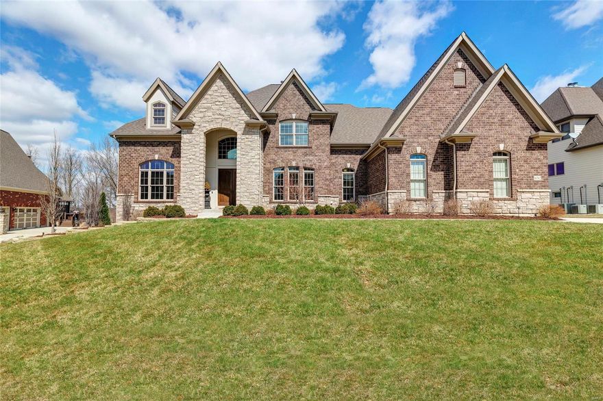 Absolutely stunning Fox Hill Farms home just hit the market in Chesterfield! Exquisite 1.5-story home boasts 4 beds, 4.5 baths & nearly 5,000 sqft. Upon entry, you'll be delighted by the grand 2-story foyer & wonderfully open layout. The kitchen is truly a dream! Entertain in style w/ the over-sized center island & breakfast bar, custom cabinetry & back splash, granite counter tops, prep station w/ wine cooler, fridge, sink & more! WOW! Enjoy the screened deck year round - complete w/ gorgeous brick-surround gas fireplace & ceiling fan. Hardwood floors span all main living areas! Main-floor Master Suite feat. his & hers walk-in closets, magnificent private bath w/ vaulted ceiling, separate sinks, custom spa-like shower & upgraded tub! Main-floor laundry, too. 2nd floor offers 3 add'l beds, ea. w/ walk-in closet, private bath! Unfinished LL walkout thoughtfully planned w/ 10' pour & rough-ins for wet bar, dishwasher, sink, full bath, laundry & full kitchen! LL & pool plans avail. Additional Rooms: Mud Room