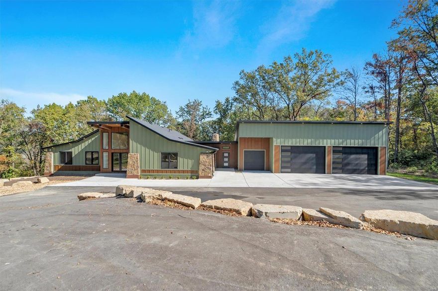 Welcome to your private oasis in South County, located in the highly sought-after Lindbergh School District. This stunning multigenerational 5-bed, 7-bath home offers over 4,400 sq ft of living space, designed for luxury and functionality. As you step inside, you’re greeted by a grand foyer leading to the spacious living room with vaulted ceilings, beautiful wood floors, and a gas fireplace. The gourmet kitchen boasts a large island, stainless steel appliances, and a breakfast bar, seamlessly opening to the dining room. The main floor primary suite is a true retreat, featuring a spa-like bath with a steam shower and heated floors. The finished walk-out lower level includes a second kitchen, living area, additional bedrooms, and a full bath—perfect for extended family living. Step outside to the serene backyard with a deck and patio, offering the perfect park-like setting for entertaining. This home includes hydronic heated garage floors zoned HVAC, a 27kW backup generator, and more!