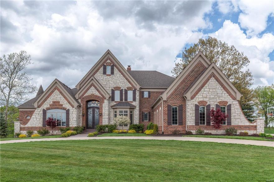 Wildwood luxury living at it’s finest. This custom built 1.5 story home is meticulous and upgraded in every facet. Curb appeal abounds from this stately home welcoming you in to the open floor plan with soaring ceilings, detailed millwork and gleaming hardwoods. The main floor offers an executive office, formal dining and spacious living room with hand hewn ceiling beams. The two story hearth room with see thru stone fireplace surrounded by built ins opens to the expansive gourmet kitchen and light filled breakfast room. Relaxing main floor master suite invites you into the luxurious master bath and oversized walk in closet. The second floor provides four addl. large bedrooms and three full baths. The lower level is perfect for entertaining with a family room, gaming area, full bath and well equipped wet bar. 4 car garage, main floor laundry, surround sound…the list is endless. Situated on three gorgeous acres in a prime West County location. Rockwood Schools. Your dream home awaits! Additional Rooms: Mud Room