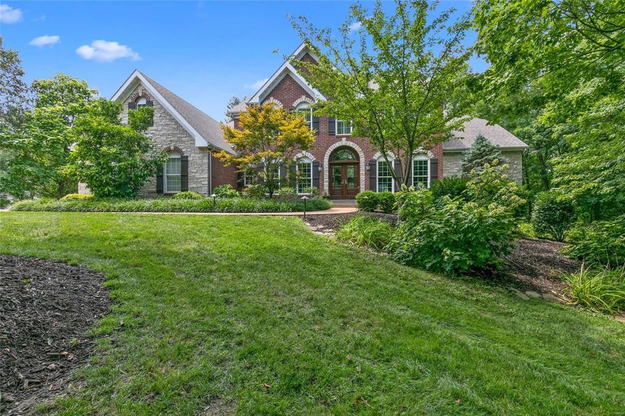 Finally!  A private, level 1.25 acre lot with a newer home in 63122!  This gorgeous lot is surrounded by trees, walkable to Kirkwood Park and close to everything Kirkwood has to offer.It feels like your own resort.  It even has a heated outdoor kitchen/deck with a built in grill, 2 gas burners, sink and fridge to enjoy the scenery year-round.The scenery includes a hot tub, pavestone patio,pond and waterfall.The home is 20 years new and this 5 bed, 6 bath beauty has over 6197 sq. ft. to spread out.  It offers the best in entertaining style while still being cozy.The inside kitchen boasts 4 dishwashers, gas range, walk-in pantry, wine fridge and opens onto the hearth room where the stone fireplace is the centerpiece.  The master is on the main level with both his/her closets and an oversized bath.  Each of the 4 bedrooms upstairs are nicely sized with a bath.The walkout lower level continues the entertaining space with a wet bar, beer tap, rec room, exercise/media room and a full bath.