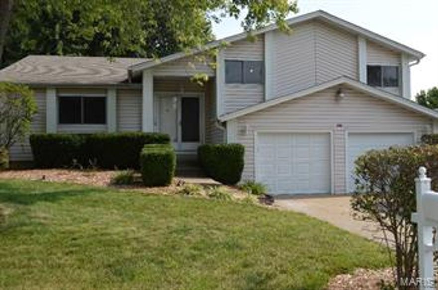 Very well kept, 4 bedroom 2 bath with rare floor plan, seldom available. New carpet throughout main level being installed once seller moves out. Covered porch & entry foyer, separate dining rm, living rm, great rm w/gas fireplace & atrium doors opening to 3 tier deck w/hot tub & pergola. Utility rm w/washer & dryer space & additional storage area. Updated master bath. Master bedroom opens to deck. Updated kitchen w/ceramic floor, cherry cabinets, center island that also serves as a breakfast bar. 3 car garage w/additional storage area. Extra parking space. Beautifully landscaped yard with in ground sprinkler system, fencing, mature trees & perennials (very low maintenance). Vaulted ceilings, ceiling fans, beautiful millwork, some six panel doors, vinyl siding. Located only minutes from RecPlex, shopping areas, schools, places of worship, medical providers & highways.