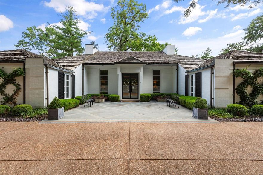 Tucked away on a private lot, this 1.5 story regency style home inspires with a truly breathtaking setting. Surrounded by lush gardens, stone patios, an in-ground pool & tennis court, your private oasis awaits. The opulent 4 bed, 5 bath residence spans over 3800 feet & effortlessly marries vibrant, chic finishes w/ handsome foundational elements. 2018 reno included all new exterior doors & windows, kitchen, baths, pool, exterior hardscape/lighting and court resurfacing and a multitude of luxurious designer finishes including lighting, wall coverings, plumbing fixtures, and flooring. Custom closets throughout. Stunning entry leads to inviting open living spaces, opening to patios. Chef's kitchen complete with a wolf/subzero suite of appliances and walk in pantry leads to Cozy hearth room. East wing includes primary suite, formal powder room, and additional bedroom suite. 2nd flr includes 2 beds, one full bath & loft space. Separate 400 sq ft storage room. 2 car attached garage.