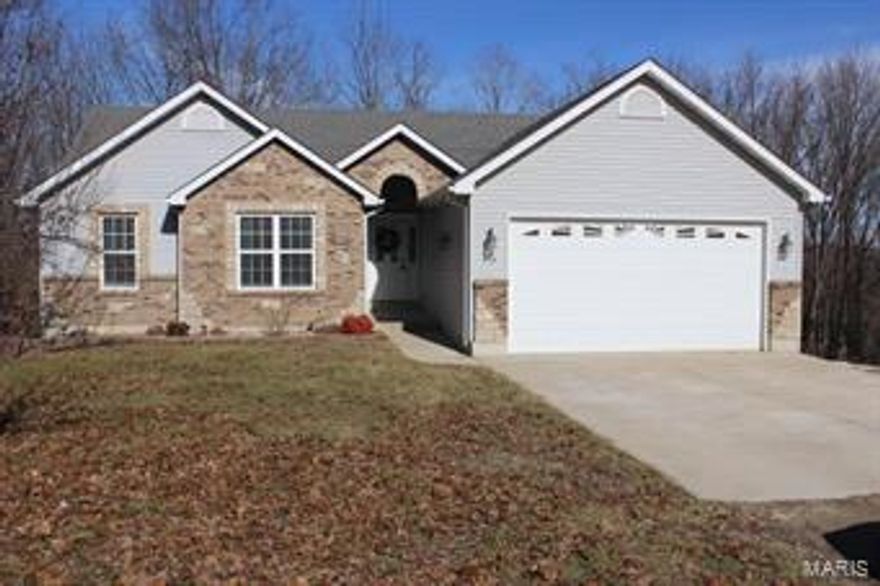 Custom built atrium ranch home on 2 acre corner lot! 3 bed, 3 full bath, with TONS of upgrades! Granite counter tops, vaulted ceilings, plant shelves, hardwood and ceramic flooring throughout, main floor master bedroom with bay window & awesome master bath having whirlpool & separate shower, open divided bedroom floor plan ,the list goes on! Full mostly finished walkout basement, family room with free standing fireplace, kitchenette, full bath, bonus/sleeping area, workshop/storage area. HSA Home warranty included!  THIS IS A MUST SEE HOME! Two one acre parcels-can keep both or sell one! Additional Rooms: Mud Room