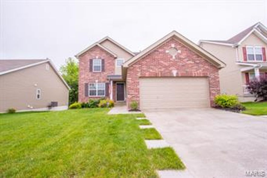 This 2-story charmer is located in one of St. Charles County’s fastest-growing residential areas.  Entering from Highway N, the neighborhood is instantly accessible to I-64/40 & Route 364, as well as the many upscale shopping/dining/entertainment facilities of Lake Saint Louis.   Highlights of the home include 3 bedrooms, 2.5 baths, a cozy wood-burning fireplace in the family room, island kitchen with stylish black appliances, convenient 2nd-floor laundry, 6-panel doors, ceiling fans & room for future expansion on the lookout basement level.  The master suite features a walk-in closet & a double sink, soaking tub & separate shower in the bath.  Tucked into the trees lining the rear yard are an inviting fire pit & play platform.   Public school students attend top-ranked Wentzville School District.