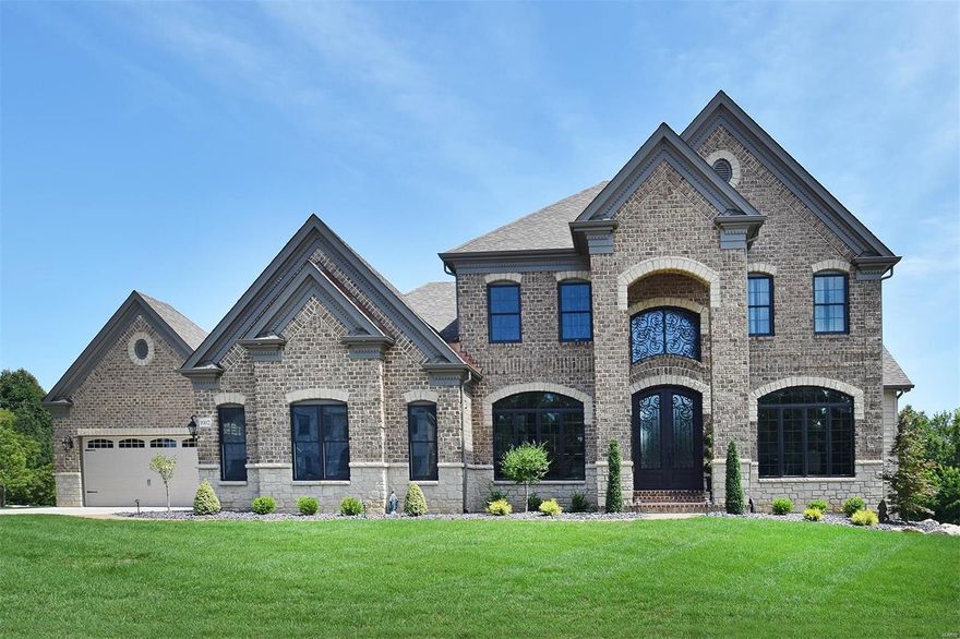 You can get brand new, right now? This incredible Claymont Development Wingate III display home is appointed with the highest quality finishes and extra options, and presented in perfect condition.  This 5 bed 4.5 bath 1.5 Story masterpiece has a terrific floor plan with loads of top-of-the-line lighting, extensive mill-work, hardwood and marble floors throughout, 2- Story windows, custom closets, etc. etc. A huge office and a Great/Living Room with a 2-Story stone fireplace and custom shelves, a Kitchen with every luxury, and a master suite that will blow you away. Upstairs are 3 additional large bedrooms and two full baths. The walk-out Lower Level will blow your mind with its engineered hardwood floors, a theater room, game room, fifth bedroom and a fantastic wet bar. Take note of the 4 Car Garage! Outside is the covered patio, a very cozy screened porch, and low voltage lighting. This masterpiece sits on the most desirable lot in the neighborhood with easy access to everything.