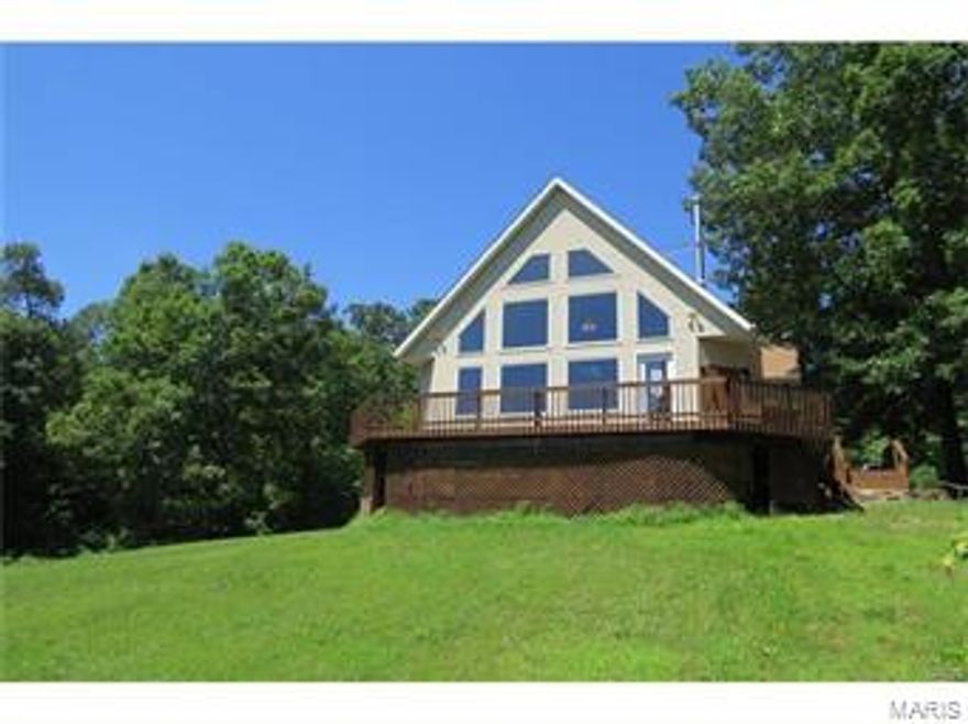 STUNNING CUSTOM BUILT HOME ON NEARLY 18 ac! This 5 bedroom 4 bath home boasts over 3200sf of very comfortable living space & offers an expansive living room with a wood stove, new wood flooring, floor to ceiling windows providing unobstructed views of land, & beautiful woo beams along the vaulted ceiling, a nicely updated kitchen with granite counters & a breakfast nook, a nice master suite, guest room, &office nook. Upstairs has a fantastic bonus room, 3 guest rooms, & a full bath. There is a great hobby room in the lower level, and a full studio apartment above the oversized 2 car garage! Even with all the wonderful upgrades & amenities you'll find inside this home, the wrap around deck which provides panoramic views of valley and countryside below may just be your favorite place to be. The land is mostly wooded - with about 3ac of pasture/cleared land. There's also a generator, dual zoned heat/AC, 2 water heaters, & so much more! Call today to see this amazing property!