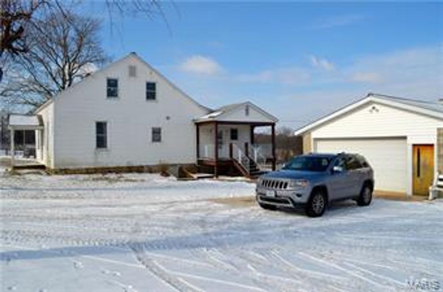 Currently a working cattle farm with a 1400+ square foot farm house, this 115 +/- acre cattle farm is about 30 minutes from St. Louis and also less than a mile from I-44 on Saint Louis Rock Road with black top to the driveway. 

The house is a 2 bedroom/1 bath, 6 room house with a walkout basement and additional storage up. There is also an outside wood burning option for heating the house. The property has a detached oversized garage and 6 multi-purpose outbuildings (Barns, equipment sheds, hay storage for over 300 round bails, silos, cattle barn, old milking barn etc.). 

There is pasture ground for hay and row crop available for additional income. Public water runs along Saint Louis Rock Road that could be tapped into for development or personal use. 

A real opportunity waiting for the right buyer.