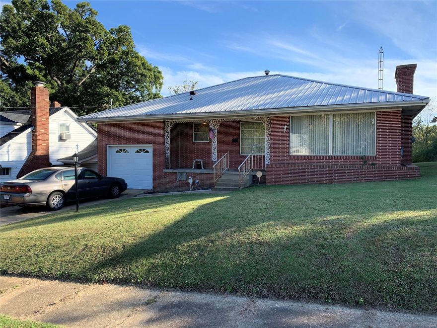 Great starter home opportunity! This 2 bedroom, 1 1/2 bath house features large bedrooms, original hardwood floors, large fenced back yard, gas fireplace to cozy up to in cool temperatures, and unique bathrooms that take you back in time! This home was built to last, with brick exterior & metal roof now it lacks only its new owners!