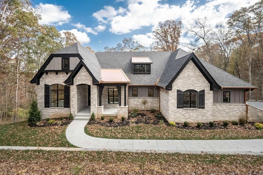 Custom built by Langeneckert Homes, this 4 bed, 3.5 bath homes offers over 3600 SFof luxury living on over 3 wooded, serene, and private acres!  The interior of the home showcases European white oak engineered flooring on the main level, and quality LVP in the finished lower level. The kitchen is outfitted with poplar and hickory cabinets, quartz counters, premium appliances, and amazing work spaces.  The Primary suite features porcelain tile heated floors in the bath, a walk in shower with 3 shower heads, anThe windows throughout the home are Pella brand, ensuring energy efficiency and optimal natural light. The exterior of the property is clad in Hardie Board cement fiberboard, offering a durable and low-maintenance siding solution. The home also features 2 composite covered decks (one offers radiant heat!), creating a maintenance-free outdoor living space. Exquisite down to every detail, comfortable luxury at every turn.  Rockwood schools and the Wildwood lifestyle you will love.