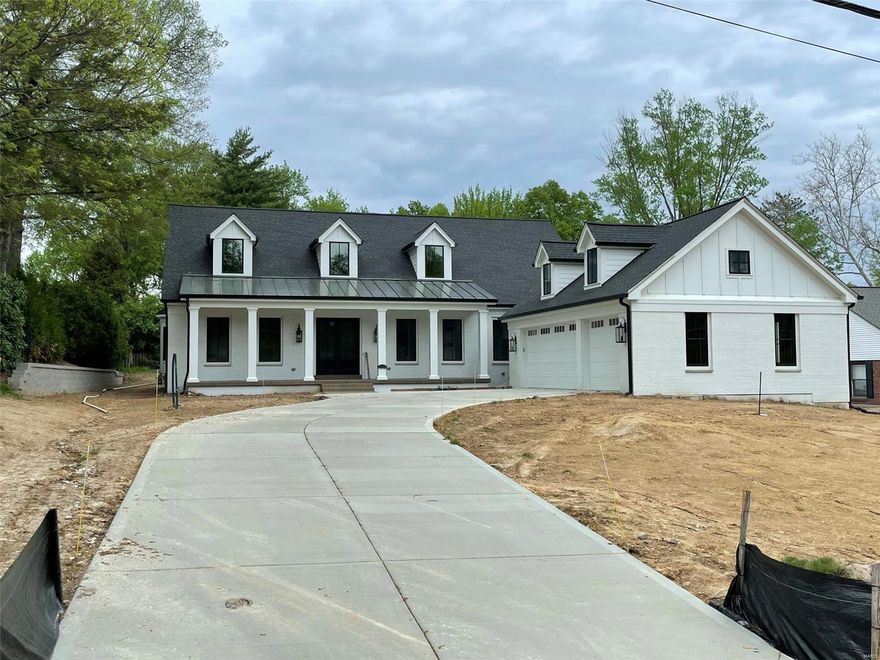 This Modern Farmhouse style custom home to be built in the heart of Ladue School District is conveniently located just 5 minutes from downtown Clayton. An impressive front porch welcomes you to a luxuriously designed home featuring a sprawling, open-concept great rm with a gas fireplace & wet bar, gracious dining room, hardwood floors, and 10ft ceilings on the main level.  The kitchen is fully equipped with a state-of-the-art Sub-Zero 48" refrigerator, Wolf double ovens & 48" stove, as well as 2 Bosch dishwashers, microwave oven drawer, custom wood cabinetry and quartz countertops. Plans include a main floor master suite with a spa-like master bath featuring marble floor and shower surround & soaking tub for your enjoyment. 3 additional bedrooms, all with full en suite baths and bonus room are all found on the second floor. Additional features include powder room, 2 laundry rooms, a study, a mud room, an oversized 3 car garage and so much more!
