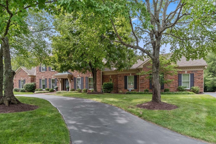 Wrought iron entry leads to welcoming dining & family rooms. Rich, hand scraped wood floors cover both living levels. Plantation shutters, wet bar, full brick fireplace & French doors enhance the 2 story great room. Recent kitchen remodel features custom cabinets w crown molding, Cambria counters, gas cooktop, microwave drawer & wine cooler. The Cambria breakfast table is built alongside the center island. The breakfast room is open to the family room & creates a warm gathering place. The master suite has a coffered ceiling, crown & dental molding & luxury bath with free standing tub. The level yard has a saltwater pool, cool deck, covered patio & is surrounded by woods. The lower level features a recreation room with fireplace, wet bar plus an exercise area large enough for all kinds of equipment, a sleeping room & full bath. Pella windows were installed in August. Hardie Board siding is slated for the coming weeks. NOTE: 2 rooms have VIRTUAL STAGING.