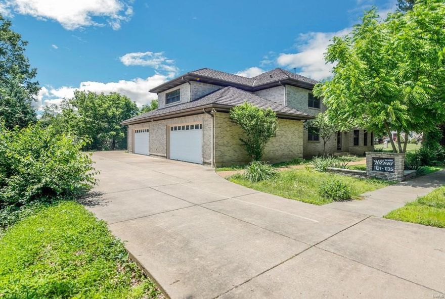 1.5 Sty w/open floorplan, 4+ Bd, 3.5 Bth, 5300+ Sqft of living space! Main Level living area w/spacious Kitchen, Butler’s Pantry & opens to Dining/Living Rm combo w/hardwoods! Electric dumb waiter services all levels of home. 2 large Bd w/multiple closets, Laundry Rm & Bth. 2nd Floor has same footprint as Main Level w/full Kitchen, 2 Bd, Laundry Rm & Bth. However, there is an add’l room above garage w/potential to be another Bd or Family/Media Rm. Convenient staircase to Attic for add’l storage. This home has a layout that can be accommodating to many & ideal for a multi-generational family. LL is expansive, featuring a full Bth & plenty of room for future living space. Highlights: central vac, 3 FP, circle driveway, solid full masonry home, wide hallways, doorways & staircases w/handicap accessibility, covered patio w/spiral staircase, gazebo, o/s 4-car garage 1350+ Sqft w/half Bth, & staircase to LL. Close to schools, parks, grocery & entertainment! HWYS 64/40, 270, 170 & 364