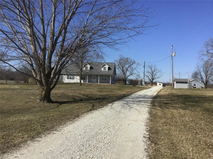 Welcome Home to this well maintained 3 bed/2 bath 2325 sq ft home sitting on 9 +/- acres.  If you are looking for a home to grow in, raise farm animals, have privacy and NO restrictions, this home is for you.  This home features 2 bedrooms, 1 bath, Large kitchen w/ custom cabinets, dining room , laundry room & large great room; all on the main floor.  Take a step out the kitchen and enjoy the screened in covered deck. Go up the stair to a  large master bedroom suite w/ his & hers large walk in closets & a Jacuzzi tub. Take a walk around the property to discover a over sized 2 car detached garage, fenced in back yard,  large barn, grain bin & additional outbuilding to store all your farm equipment. This home/property is perfect for a small farm.  Did I mention there are NO restrictions? Country setting at its best! Just 16 miles to Bowling Green