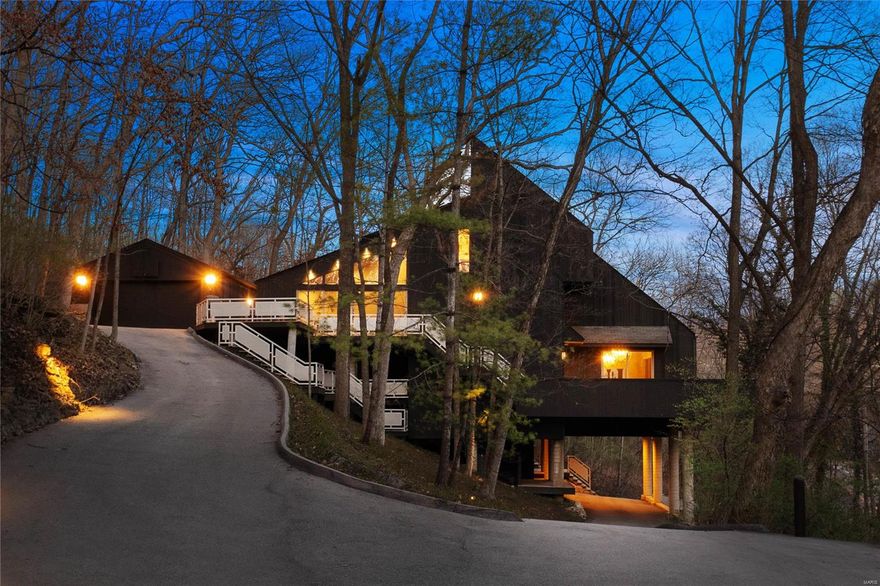 Fall in love with this timeless and modern masterpiece, perched among the trees on 1+ acre in Sugar Creek Nature Preserve. With its multiple decks, this home offers an ever-evolving indoor-outdoor living experience. The kitchen features black marble countertops & backsplash, a huge picture window, custom cabinets & a spacious pantry. Marble flooring flows from the kitchen to the adjoining dining room with a vaulted ceiling, wall of windows & access to the upper deck. The primary suite offers wooded views and features a bath with a marble dual vanity, abundant closet space, and access to a deck. The sunken living room is flooded with light and leads to multiple indoor & outdoor living spaces. The upper-level guest suites, each with an adjoining sitting area & multiple closets, share an updated full bathroom with dual vanities. 4th bedroom with en-suite bath. Minutes to downtown Kirkwood, restaurants, & the farmers market + walk to Kirkwood Park.