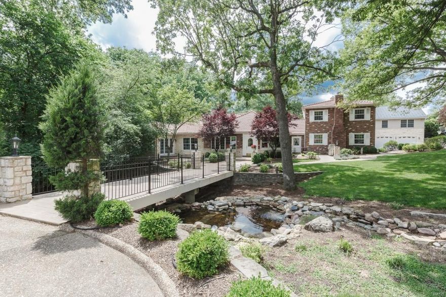 Spectacular 1.5Sty, on a 1.5 acre lot. 5Bds, 7Bths(5F/2H) & 6100+ sqft of living spc. Entry w/grand staircase, coffered Living Rm w/custom frplc, vaulted Dining Rm w/arched Palladian windows, Kitchen w/cooktop w/custom hood & fridge w/cabinet panels. Brkfst Rm leads to Family Rm w/frplc & built-ins. Master Retreat w/Sitting Rm, screened-in porch & luxury Bth w/granite tops, jet tub & custom shower. Powder Rm & Laundry Rm complete Main Level. The 2nd Flr offers; 4 add’l Bds; 3 full Bths; 2nd Family Rm; Game Rm w/wood ceiling, kitchenette & 2nd Flr Laundy (W/D included). 2015 Updates; furnace, W/O LL w/Rec Rm, Wine Cellar & Powder Rm, hardwood flrs, carpet in Bdrms, int & ext doors/trim paint. Highlights; new tile roof (2014), 3 car garage w/full Bth, storage, irrigation system, audio system & central vac. Relax outside & admire the waterfall & 2 ponds. Perfect for entertaining! Great location–close to shops, restaurants & parks!