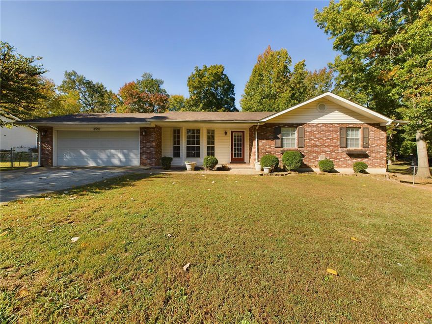 6305 Pinecrest Drive, Poplar Bluff, MO- Large 3/4 bedroom brick and vinyl raised ranch home for sale just West of town under mature shade trees on approx. 1 acre! The large yard is fully fenced with a detached garage / workshop, offering ample room for outdoor activities. Upon entry you are greeted by an open living area and upgraded kitchen featuring real hardwood flooring and ample custom cabinetry. A large living room with LP fireplace and generous windows leads through a four-seasons porch / office and finally outside to the huge back yard. The bathrooms have been upgraded with stone countertops and newer fixtures are found throughout the home. There's a partial basement that is finished and serves as BR4 / game room / flex space. Back outside to the workshop, you'll be pleased to find additional utility hookups in place should you wish to build a larger shop or RV shed, etc. You are certain to enjoy the quiet and relaxing setting while enjoying the convenience's of town nearby.