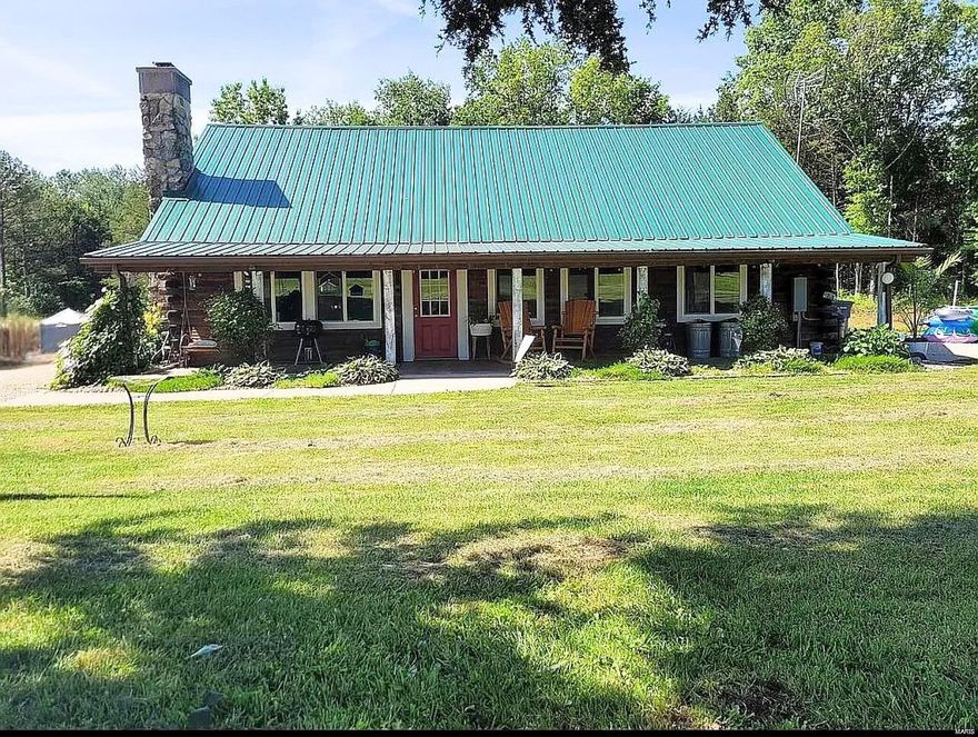 Make this spectacular log cabin estate your own personal sanctuary. Nestled on over 20 breathtaking acres with a stocked pond, this exquisite 1.5-story log cabin offers the perfect blend of rustic charm and modern convenience. With a spacious 1,200 square feet of living area, this home is designed for comfort and style. The main cabin boasts an open floor plan, providing ample space for entertaining and family gatherings by the wood-burning fireplace or cooking a feast in the modern kitchen with stainless steel appliances, granite countertops, and plenty of storage, making it a chef's delight.

Tiny Log Cabin home does not stay, but could be negotiated. 

Don't miss out on the chance to own a piece of serene country living!