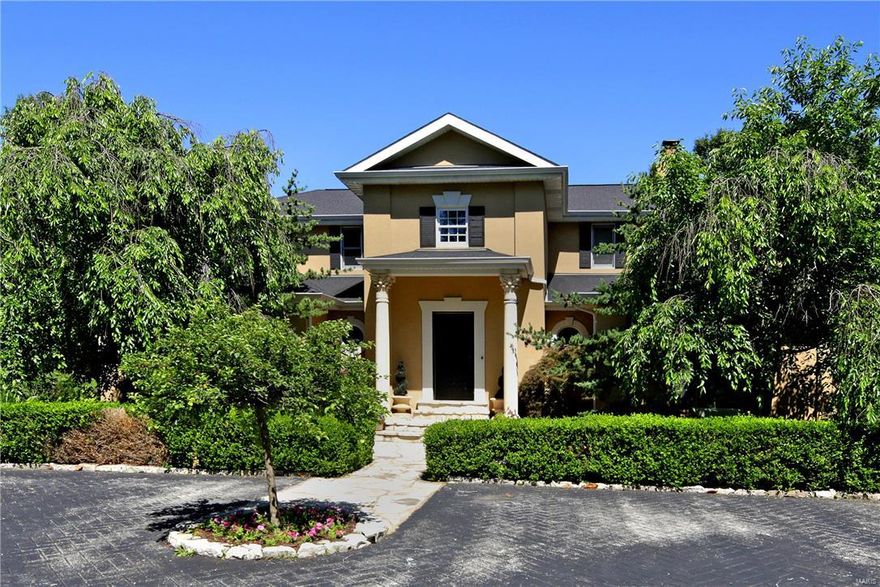 When you step into the entry you will feel like you have discovered your own private resort. Tucked away on an acre plus lot, this four bedroom home has it all. The great room features a painted domed ceiling, raised hearth fireplace and large picture windows that over look the Pebbletec pool with a waterfall feature, patio with an arbored pergola, and newer outdoor kitchen with fireplace and smoker. The first floor also boasts a formal living room, family room with built in cabinets and bookshelves, an eat in kitchen with center island and planning desk and first floor laundry room. The spacious main floor master has a huge walk in closet with built in dressers and a bath with walk in shower and double sinks. Upstairs you'll find three more bedrooms and two full baths. The expansive lower level has a family room with a slate floor, stone fireplace, wet bar and 1000+ bottle wine cellar. There is also a play room with built ins, an exercise room and fabulous full bath with steam shower.