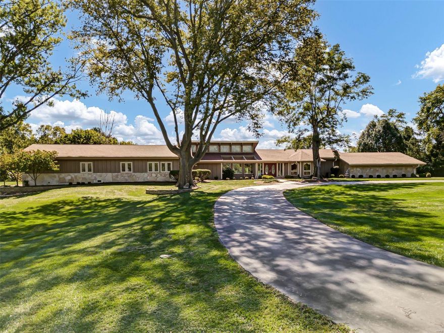 Limited Time Opportunity! Sprawling ranch on 3 acres backing to woods in a quaint, private enclave of luxury estate homes. Close to wonderful shops, dining, & conveniences, I-64/364. Saltwater pool w/recently refinished expansive pool deck, stacked stone waterfall, hot tub, gazebo, & 10' depth diving board. Spacious, open floorplan ideal for entertaining! Chef's kitchen w/granite counters, custom cabinets w/roll-out trays, tiered breakfast bar island, butler's pantry, 4 wall ovens, 6-burner gas cooktop & chimney hood, & built-in fridge. Gather by the gas fireplaces in the great room w/wall of windows overlooking the pool or the hearth room. Outstanding primary suite w/2 separate ensuite baths & private sitting room. In-law suite w/kitchen, 4-season room, 2 bedrooms, & bath. Finished lower level rec room w/pool table. Rear-entry 3-car garage w/epoxy floors, whole house emergency generator, updated roof & water heaters, zoned HVAC. Won't be on the market for long. Don't wait! See it now! Additional Rooms: Sun Room