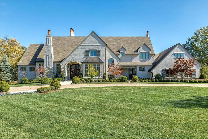 A rich blend of brick, stone & stucco defines the rustic elegance & timeless architecture of this European-styled Estate home. Travertine marble foyer leads to private study with stone fireplace & custom built-ins, elegant dining room & stunning great room with hand hewn beams & floor-to-ceiling fireplace flanked by bookcases. Designer kitchen featuring quartz countertops, glazed cabinetry & commercial grade appliances adjoins light-filled breakfast room & vaulted hearth room with full-height fireplace. Coffered master bedroom suite radiates warmth with a stone fireplace, wide bow window & marble bath. Front & rear staircases access 4 additional ensuite bedrooms, bonus room & 2nd floor laundry. Lower Level includes recreation room with gathering bar & wine cellar, game room with fireplace, media room, office, workout room & full bath. Situated on a 3-ac lot with outdoor living room with grilling station & fireplace, pool house, spa & resort style pool surrounded by landscaped gardens. Additional Rooms: Wine Cellar