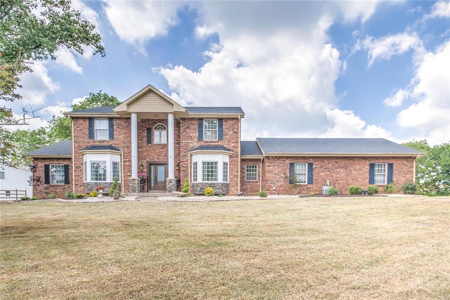 Stately  4350 square foot 1.5 story on 3.4 acres in Sunset Hills! Unbelievable level lot with inground pool and snack bar that you can view while sitting in your great room with a wall of windows or from your lovely sunporch!  3 car detached garage/barn with finished space above! This home has some fabulous upgrades including huge kitchen with island that seats 8 and a lovely new master bath. Upstairs is a second master suite with 2 addtional large bedrooms and an updated bath.  There are in law quarters on the main floor w/ a private bath as well.  Want a baseball, football or soccer field in your yard?? A must see for anyone who wants room to play!!!