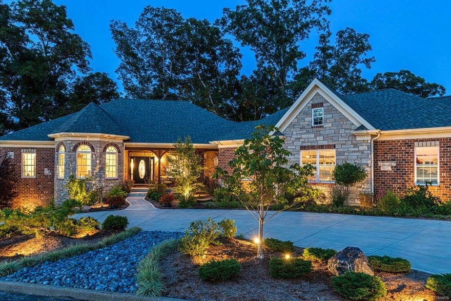 Stunning brick & stone ranch home on Whitmoor Country Club grounds. Open floor plan features sophisticated interior detailing & appointments throughout. Vaulted entry foyer leads to living room with extensive millwork & spectacular great room with floor-to-ceiling marble fireplace & full-height windows that offer perfect views of the 18th hole on the South course. Designer kitchen with glazed white cabinetry, quartz countertops & Thermador appliances adjoins light-filled dining room that opens to outdoor living area. Coffered master bedroom suite provides an appealing retreat with walk-in closet with laundry & luxury bath with jetted tub. A 2nd bedroom/study with bay window & hall full bath complete the main floor living quarters. Walk-out Lower Level includes recreation room & 2nd kitchen with 16’ stacked stone bar plus hobby room, 3rd bedroom, guest suite & full bath. Situated on a wooded .63-ac lot with deck, patio & 4-car garage. Clubhouse, pool & tennis courts are just steps away.