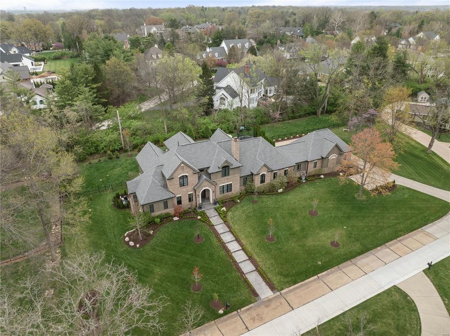 Located within a quiet Frontenac neighborhood, this exquisite 5-year-old home epitomizes modern elegance and functionality. Designed for today’s busy lifestyle, this home offers every amenity buyers crave, including luxury main flr primary suite, 2 main level offices, gorgeous pool and even an indoor basketball/sport court. Find soaring ceilings, lg windows and glass doors, gorgeous wood flooring and an open layout combining a fam area, lg custom kitchen, din rm(currently a sitting rm), laundry rm, mudrm and 2 guest powder rms.  A lux bath and his/her lg custom closet complete the main flr primary suite.  3 lg bedrm suites with laundry comprise the 2nd level.  A lg rec rm, bedrm, full bath, media rm and gym provide the lower level living spaces.  High end finishes, clean lines and designer touches are found throughout this gorgeous home.  3 car garage, generator, Ladue Schools and more.  This home is what every buyer is looking for.