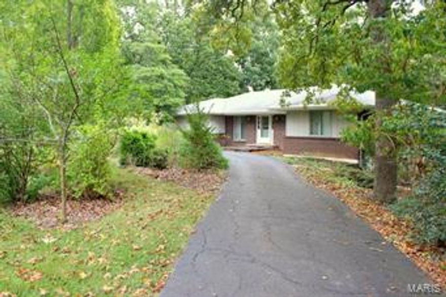 This home is private but still close to everything. On the main level of this ranch home you will find a kitchen that has openings to the dining area & the family room so you can stay connected to family or company. The dining area is easily accessible from the kitchen. The family room has a huge fireplace to enjoy on those upcoming chilly days. As you enter this home you walk into the great room that has ceramic tile. You could use this room as one big great room or possibly a sitting area and formal dining. The main level also has two bedrooms, one of which is a master bedroom suite. The master was two bedrooms in which has been made into one. From the master you can see out through the greenhouse. YES GREENHOUSE!!! It can be accessed from the master bedroom, downstairs or outside. Check out the additional pics to see for yourself. Downstairs there is an additional bedroom and full bath as well as lots of storage and a large area that with flooring could be a finished rec area.