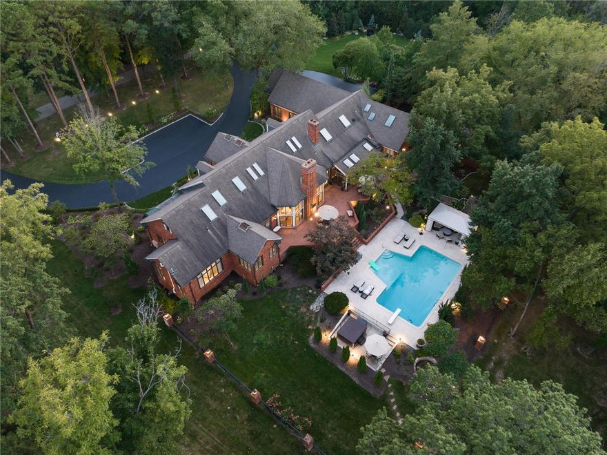 Resplendent. A fully renovated Huntleigh Estate completed in freshest finishes and painstaking attention to detail for beauty,  functionality and efficiency throughout. An elegant 8,500 square feet total living area is a remarkable signature home. Soaring ceilings of  11-14 feet, skylights and an open floor plan articulate spaciousness. Expansive tiered patios, a 1500SF diving pool, cabana, custom fire pit, and spa make outdoor entertainment statements. Grounds are accented in commercial lighting. The Showcase kitchen is featured in numerous periodicals; sophisticated appointments include LaCornue range, lavish marble topped island and Hearth & Breakfast Rooms with luxurious butler pantries. Three Main Level bedrooms including the Primary are all suites, with separate showers and tubs. The Lower Level is above grade and walkout, home to the 4th Bedroom with it's own steam shower in the bath. Garage parking for 5 vehicles. Additional parking courts and circle drive. Simply breathtaking.