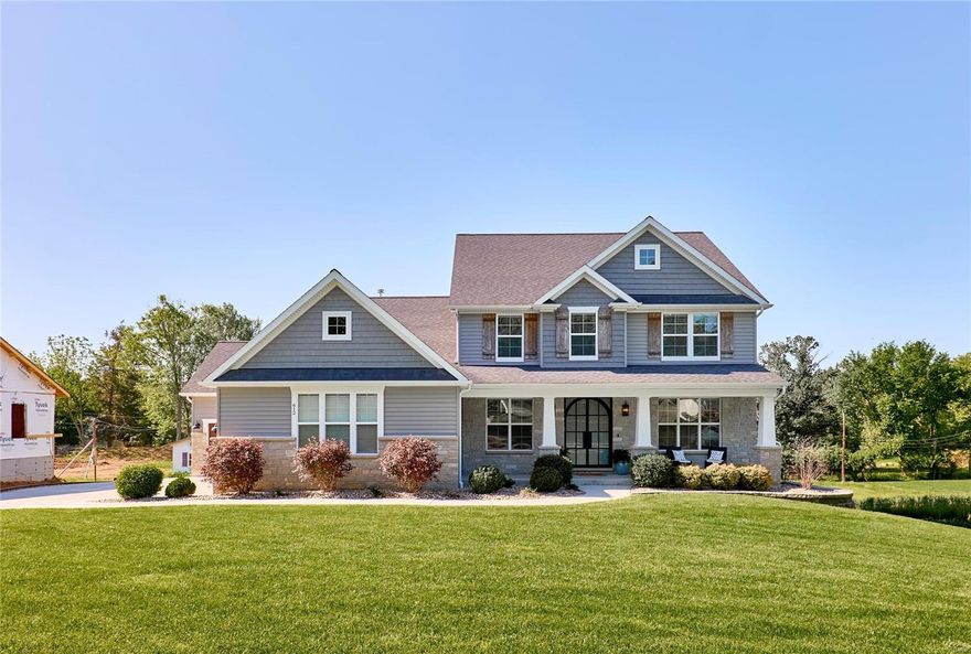 Gorgeous 1.5 story home on level ½ acre+ lot is loaded with custom features and high-end extras.  Impressive arched iron entry doors open to 9’ ceilings, hand-scraped engineered flooring, oversized moldings, custom millwork & low-e Pella windows throughout.  Open kitchen features 9’ island, under-cabinet lighting, SS Bosch appliances, 2 pantries & soft close cabinetry & adjoins laundry room & convenient storage cubbies.  Breakfast room slider leads to 15X14 composite deck overlooking private back yard.  Luxurious MF owner’s suite w/coffered ceiling, 2 large walk-in closets & luxury bath.  Upper level offers 3 additional spacious bedrooms (all w/walk-in closets) and bonus room.  Enjoy the deep pour finished walkout lower-level w/rec room, dry bar, full bathroom & office/sleeping room.  Other features: oversized insulated & drywalled 3 car garage,  zoned HVAC, 50 gal water heater, inground irrigation system, upgraded lighting & plumbing fixtures throughout.