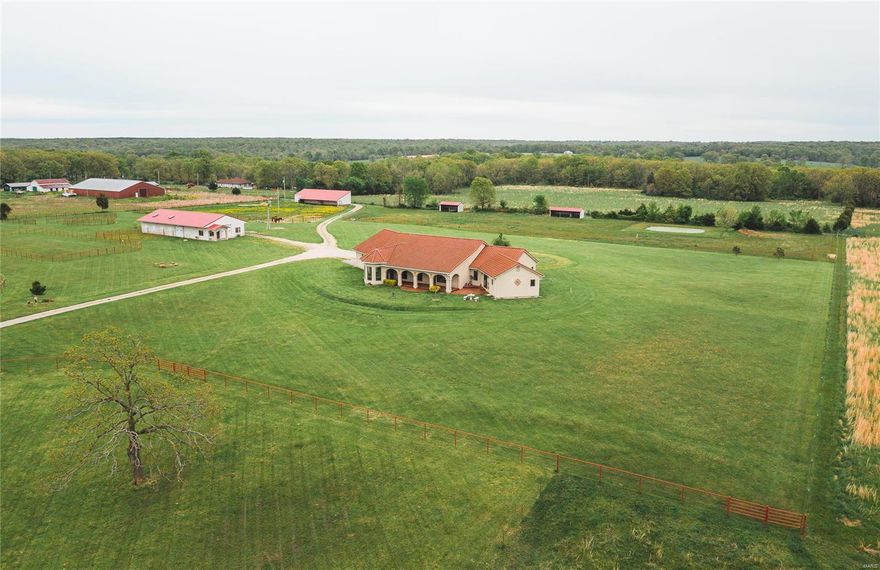 Custom Equine Ranch with a 3500 sq ft. unique home on 21+/- acres. The property has been meticulously maintained and attention to detail was first in mind when building the home and barns. The property is all pasture for the horses and it has a small pond for fishing. There's Custom cable fencing and cross fencing in place and also an 8 stall 36 x 80 horse barn with individual doors to the pasture. There is also a concrete floor and extra tall ceilings for a horse trailer or hay storage. Many tack rooms for feed, storage, and even water and a wash room for horses.  Office room with a/c and a bathroom. There is also 3 horse weather shelters and a machine shed or hay barn. There is also sewer, water, and electric hook up for an rv near the barn. This is a beautiful Equine property. Don't miss out.