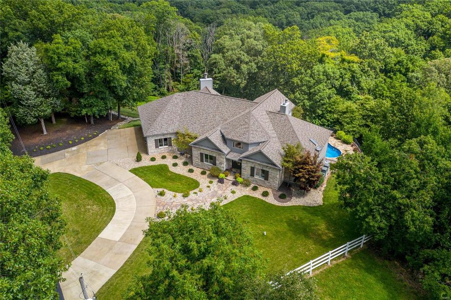 Are you ready for a home that is a private retreat with over 3 acres & every amenity on your "wish-list"? This stunning custom built atrium ranch has been completely updated & is ready for you to make new memories.  Walk into a 2 story foyer that opens to a great room w/vaulted ceilings then wind your way through this stunner and fall in love! Your gourmet kitchen w/custom cabinetry, lg. granite center island, walk-in pantry & breakfast room overlooking the pool will be the perfect spot to start/end your day.  When you aren't relaxing in your salt water pool surrounded in wooded privacy you can get cozy by your lodge-like fireplace complete with a walk-behind hearth room wet bar. MB w/jacuzzi tub & custom shower will help you unwind & enjoy the quiet, even with a house full of guests.  This spacious layout w/LL in-law quarters will quickly become the holiday favorite hang out.  Updates include: new carpet, fresh paint, built in speakers, new LL shutters, finished 3 car garage & more!