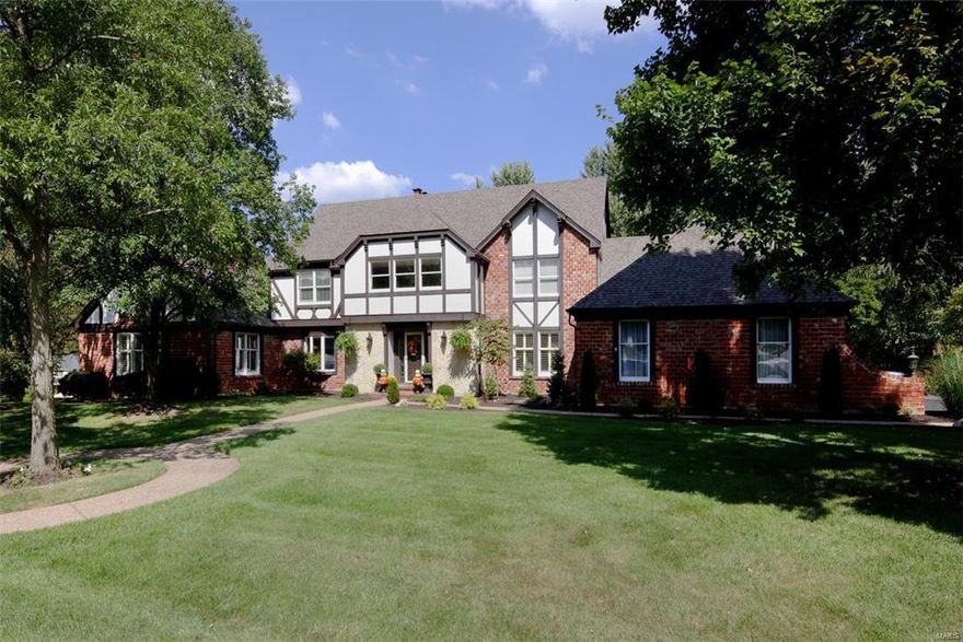 This sophisticated 1.5 story 5 bedm, 4.5 bath home has over 6500 sq. ft of total living space with updates galore! The magnificent two-story entry w/ sweeping split staircase is a grand centerpiece. The gourmet eat-in kitchen features new granite counters,new marble backsplash, new lighting, updated cabinetry, stainless appliances and fresh lighting. Adjacent to the kitchen,the main floor family room is cozy & light filled with its built-in bookcases, gas fireplace & access to the back deck. The master suite & sitting rm w/gas fplc are a true escape complete with a recently renovated master bath.The formal living & dining rooms are light filled and add to the ease of entertaining. The upstairs bedrms are generous in size. There are 2 recently updated hallway baths that serve the bedrooms.The finished walk-out lower level includes a large wet bar, full bath,multiple living areas & plenty of storage. A 4 car garage, main flr laundry & great outdoor living spaces add to the ease of living