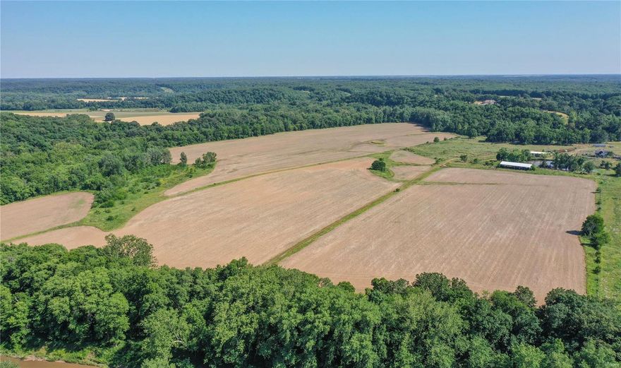 entered for comp purposes only: Stunning view overlooking bottom ground, Cuivre River. Circle drive, side-entry heated garage with bath. Surround sound throughout home, 5 speaker surround for tv. Radiant floor heating in basement, main floor & garage - 7 heating zones. Upgraded ADT security on all doors/windows/garage. Granite countertops. High-end appliances include Miele dual dishwashers, double convection ovens, 6-burner Viking gas stove, double Viking professional char-grills, custom range hood, Sub-Zero refrigerator. Foam insulation, additional R-19. Pella windows and doors. Convenient central vacuum. Massive walk-in custom pantry plus lower level walk-in cooler. Outdoor hookup for gas grill. 500 gallon propane tank plus central wood burning stove (electric backup). Soffit outlets with switch for outdoor holiday lights. Newer water heater & garbage disposal. Additional safety features include slip-resistant stairways & roof lightning rods. 332+/- acres includes multiple parcels.