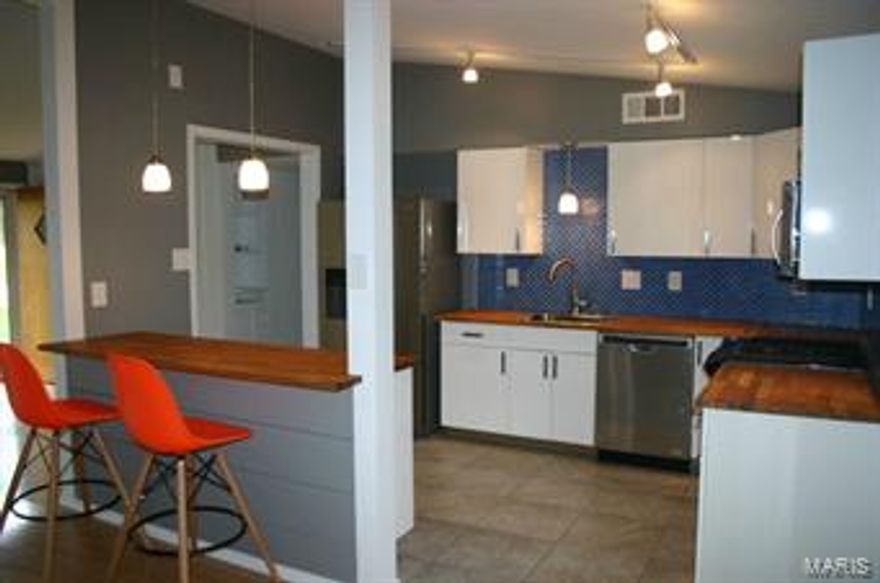 Home was renovated specifically for this Buyer.  New exterior including roof, windows, trim, siding, soffits, gutters, etc.  New modern kitchen design selected by Buyers and updated bath fixtures and tile. New appliances, deck, and more.  Great modern interior.  Yard and landscaping to be completed by buyer after closing.