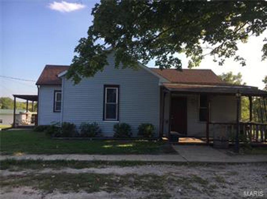 Are you in the market for a low house payment? This 2 bedroom 1 bath house is perfect for you.  There is new soffit, replacement windows, and new water lines.  The roof is less than 5 years old.  You have options for heat, there is a wood burning stove or a propane furnace, the propane tank is owned.  There are 2 window units that can cool the entire 1200 square feet, both convey with the property. The shed has a concrete floor and electricity. This property is in move in condition and ready for a new owner. Additional Rooms: Mud Room