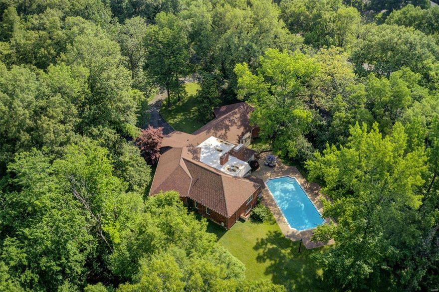 This picturesque 1.83 acre estate located in the heart of Ladue is sure to evoke vision and creativity. Custom built in 1971 for a well-known Saint Louis icon, the late restauranteur Al Baker and his family, this home truly tells a story. Featuring intricate millwork throughout, soaring ceilings, leaded and stained glass windows, two woodburning fireplaces, 4 bedrooms, 5 ½ baths and over 4100 square feet of thoughtful living space. Beautifully situated on a secluded lot overlooking mature trees and the well maintained inground pool. This property is beckoning its next chapter and is ripe with potential or could be a wonderful location for a new custom home.

Property is sold as is and some lighting excluded from sale.