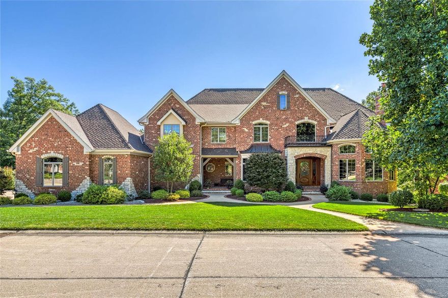 Magnificent 8900 sf Schaeffer-built Estate home situated on a spectacular lot on the bluffs of the Missouri River. 2-Sty marble foyer with dramatic curved staircase opens to handsome library with 14’ box beam ceiling & fireplace with oak mantel, elegant dining room & stunning great room with marble fireplace, wet bar & wall of windows with unsurpassed views.  Designer kitchen with granite countertops, 42” custom cabinetry & commercial grade appliances adjoins breakfast room with dimensional ceiling, bay window & atrium door to screened porch & vaulted hearth room highlighted by floor-to-ceiling stone fireplace. Primary bedroom suite with wide bay window & lavish bath with shower spa & Jacuzzi offers an appealing retreat. Front & rear staircases access 3 ensuite bedrooms & loft sitting area. Walk-out Lower Level features recreation room with wet bar & 4th fireplace, media room, office, 5th & 6th bedrooms & 1 ½ baths. Grounds include private deck & patio surrounded by landscaped gardens.