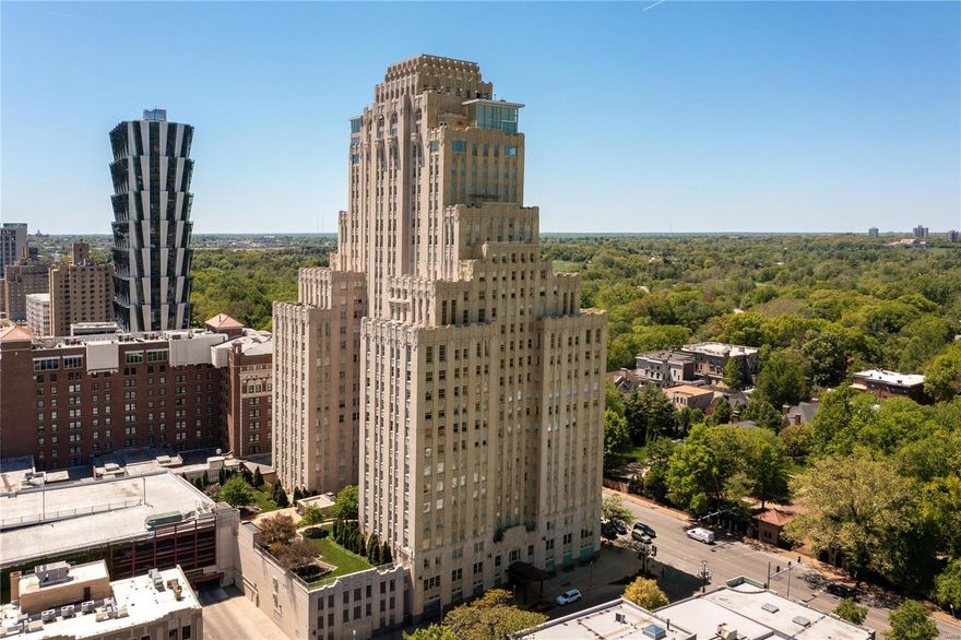 As the sun rises over the Central West End, take in the breathtaking view of St. Louis' finest architecture! The foyer sets the stage with its stunning marble floor and elegant coffered ceiling. An impressive bar area leads to the living room with a wall of windows that offers a panoramic view of the world outside. The gas fireplace, built-in bookcases, and gleaming hardwood floors add a touch of drama to the space, creating a warm and inviting atmosphere. The kitchen is a chef's dream, with top-of-the-line Thermador appliances, including a 5 burner gas range and a plethora of cabinets and counter space. As the day draws to a close, retire to the primary bedroom - complete with four custom closets and a sophisticated bathroom with double vanities, a walk-in shower, and soaking tub. The ensuite secondary space is versatile, functioning as a bedroom and/or office. There is an in-unit laundry room and 2 garage spaces. Enjoy easy living in the CWE and walk to all the restaurants and shops! Location: City, Corner Location, End Unit