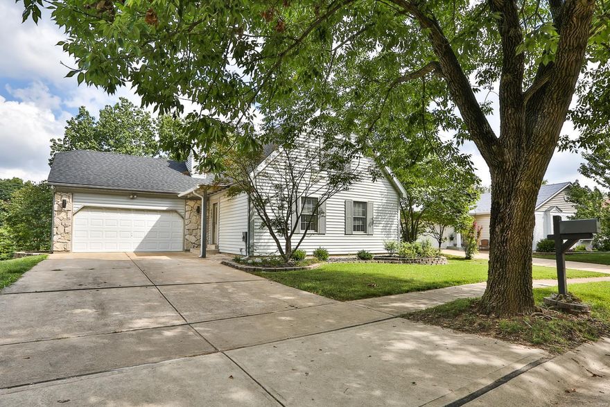 Fabulous 3 Bedroom, 2.5 Bath, 1.5 Story home offers numerous updates & an amazing open floor plan. Vinyl siding exterior with stone accents & entry door with inserted blinds welcomes you into the living room displaying a floor to ceiling brick, wood burning fireplace, bay windows & modern track lighting. Stunning updated kitchen shows off 42" custom cabinetry with soft close, subway tile backsplash, 1X2' tile flooring, double sink with pendant lighting & all appliances. Breakfast room features 1X2' tile flooring, a 10' breakfast bar & an atrium door walkout to the back deck. Master suite offers dual open closets, track lighting & bath with oversize vanity, designer lighting & shower. Secondary bedrooms upstairs have double door closets & easy access to the beautifully updated full bath. Lower level provides a Rec room and 2 bonus rooms. Walk out to the tree lined lot and patio. Enjoy the oversized, heated 2 car garage, newer roof, newer HVAC, newer driveway & Parkway schools!