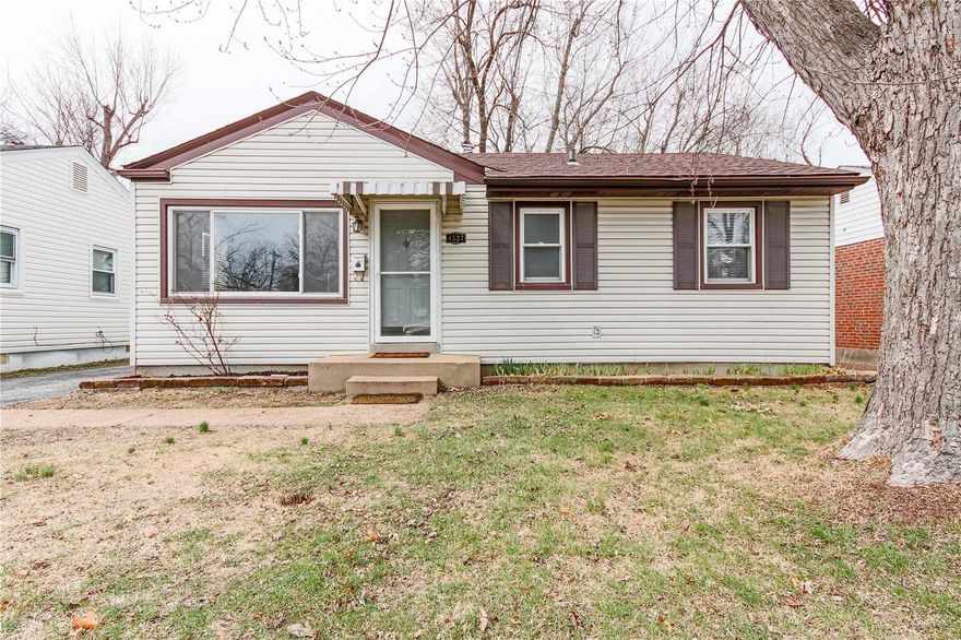 Wonderful well-maintained move-in ready home boasts huge detached 2-car oversized garage plus versatile family rm addition w/2nd bath increasing home living space to 1,186 impressive sq. ft! Check off many exceptional features from your wish list... level fenced yard, abundant parking space, mature trees, upgraded architectural roof, low-maintenance vinyl siding, energy efficient thermal windows, updated elec service/mast, newer metal exterior drs, fresh neutral carpet/paint, updated furnace blower/HWH & A/C condenser, digital thermostat. Streams of natural light, large picture window, vinyl entry in inviting liv rm. Cheery updated eat-in kitchen, white cabinets, faux granite counters, stylish wainscot backsplash, upgraded vinyl flr, stainless dishwshr, gas stove, built-in micro, double stainless sink, refrig incl. Main flr laundry, separate din rm, 4 ceil fans, updated vanities, ceramic tile/fiberglass shower. Nice view/backs to St. Ann Park, Great City amenities, Pattonville Schools!