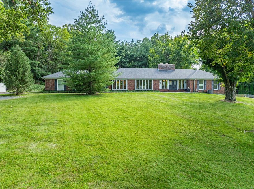 Welcome to 10622 Mentz Hill Acres Drive, a stunning 4 bedroom estate in Sunset Hills, just off of Kennerly Rd. Situated on 3 acres of picturesque land, this property boasts engineered hardwood floors, a newly updated kitchen with stainless steel appliances, and a finished basement that was recently renovated in 2022 to include another kitchen. The basement walks out to the breathtaking pool deck and pool, perfect for entertaining guests. The home features two new furnaces, two new hot water heaters, electric updates, and a new pool pump. With an attached two car garage, detached 4 car garage, and a barn with a brand new roof, this property has it all. Don't miss the opportunity to make this dream estate your own!