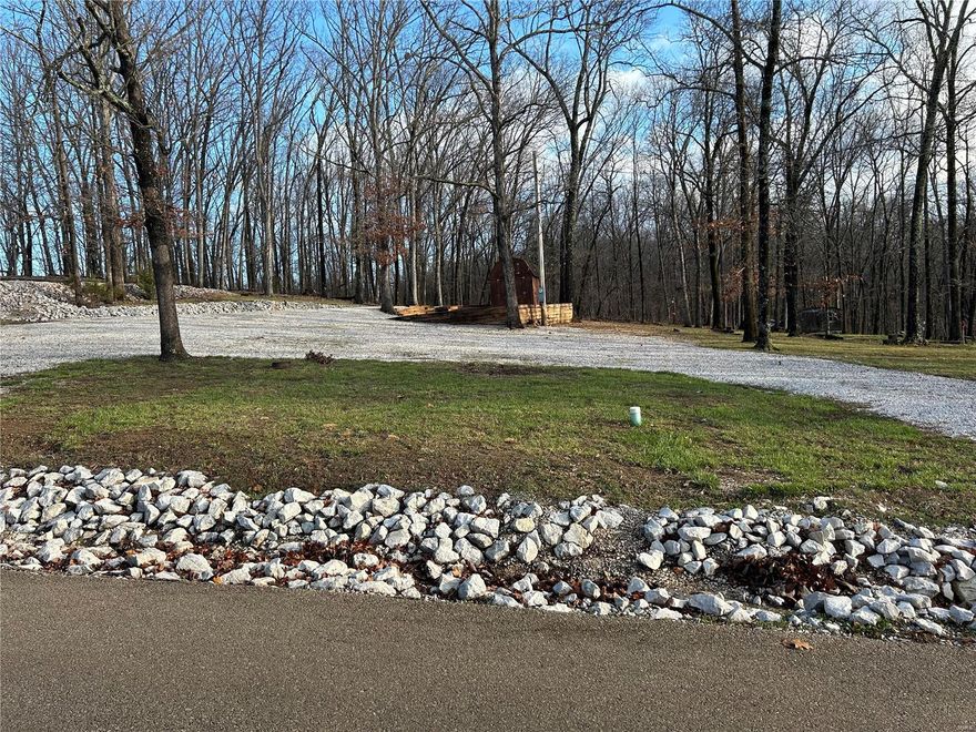 No permits needed for this full-time camping lot within the gated community of Lake Perry. This lot is camp ready with electric and water already in place and sewer hook ups at the road if you decide to go that route! This lot has been well maintained and features a circle drive, shed for storage, and a fire pit. Lake Perry features a 200 +/- acre lake, eat in restaurant, community pool, and much more. Summer is quickly approaching so grab your friends, camper, and boat to enjoy all that Lake Perry has to offer.