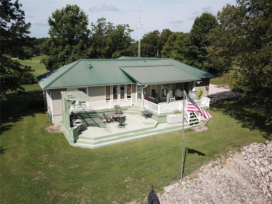 If you are looking for a quality built home with Black River access, then you have found it! This updated home has 2 bedrooms and 2 full baths. It has a master bedroom suite with a walk-in closet. Everything is on one level, including the laundry area. The living area of the home and the deck focus on the river view. Picture yourself entertaining or grilling from the deck, or imagine just a peaceful morning on the deck listening to the river and watching the wildlife. This home is aprox. 20 years old, built with quality and durability in mind. The home has steel siding and steel roof. There is an efficient geothermal heating system. The home has an attached 2-car garage with an office area or "man cave". Plus property has a 40x30 shop with an attached carport, a bathroom, and a wood stove. As a bonus there is a tool shed, with a concrete floor, a large wash basin for cleaning fish, and a beautiful pergola. All of this sets on 5 acres. Great retirement home or vacation home!