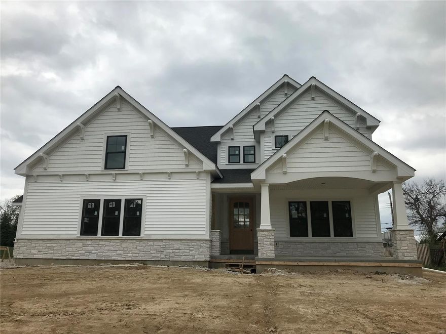 Spectacular modern farmhouse 1.5 story under construction by Boulevard Custom Homes.  This 5 bedroom, 4.5 bath, home features astounding finishes which include a 3-car side entry garage, metal roofs, hardwood flooring 1st floor and 2nd floor hall, gourmet kitchen with true custom cabinetry, large island and peninsula counter, crown molding, soft close drawers, 3 lazy susan's, pull-out spice rack, trash pullout, Quartz countertops, stainless steel appliances, under cabinet lighting, large walk-in pantry, built-in lockers, and impressive screened in rear porch.  12' high beamed ceiling in great room offers a fireplace, wine bar with wine cooler,  den/study with wainscot. Elegant master bath suite has coffer ceiling, large walk-in closet, adult height vanities, stand alone tub in master bath.Other amenities include mahogany wood front door, LP Smartside prefinished siding, wood treads on stairs,expansive 2nd floor bonus room, 2 full baths on 2nd floor, large bedrooms with walk-in closets. Additional Rooms: Sun Room