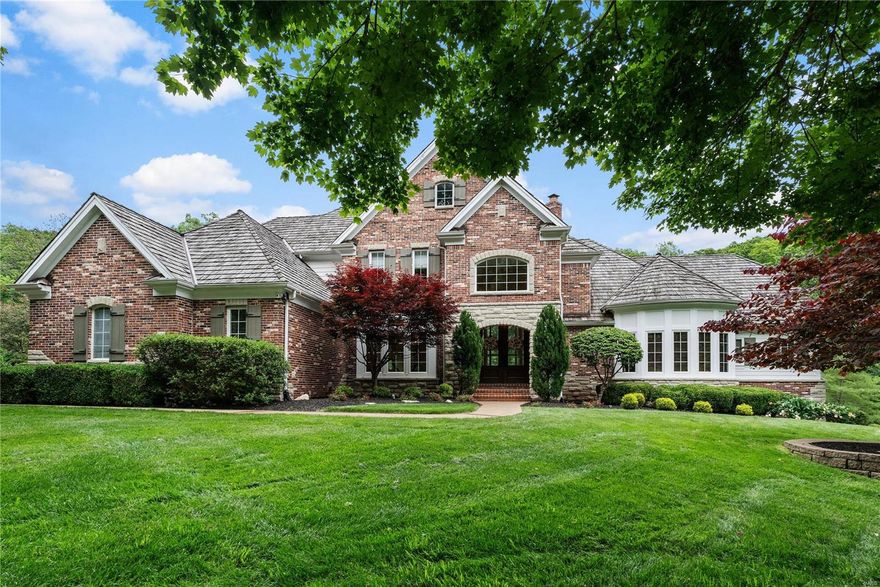 When you enter the foyer thru double front doors in this gorgeous custom home, you can't help but say WOW! The wide planked French styled wood flooring boasts intricate patterns, ceilings are soaring w/expansive wood beams or inlaid millwork & the view from a two-story wall of windows in the great room frame a picturesque 1.26 acre level lot nestled in the trees. Some of the many renovations include newer HVAC systems, smart thermostats, humidifiers, & hot water tanks, extensive custom ceiling treatments, & millwork, butler's pantry w/lighted shelving & glass doors, newer limestone fireplace, complete primary bathroom & laundry/mud rm remodel, newer light fixtures, stainless steel appliances, all new carpet leading to & on second floor, expanded outdoor patio, professionally painted kitchen & second floor bath cabinets,exercise rm (hidden behind custom bookcase/door),600 bottle wine cellar, built-in bookcases frame LL fireplace, LL custom bar w/appliances, & Tesla car charging station. Additional Rooms: Wine Cellar