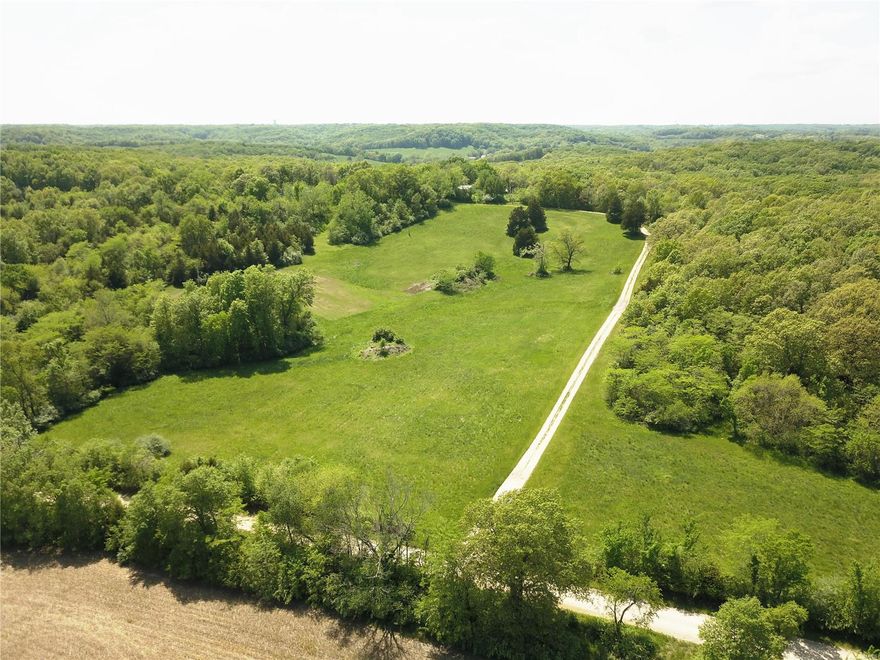 Set your sights on this 200 acre "Wildlife Haven"! This secluded property lies in the rolling hills of southeast Pike County and is known for its trophy whitetails, abundant turkey population, and surplus of small game! Watch the sunrise from atop the main ridge offering a 10 mile view, then hop on an ATV and ride all day on many of the manicured trails. Or, just relax under a shade tree and count your morels. For hunters, this property is situated between two row-crop farms and has strategically placed food plots, watering holes, and plenty of natural bedding areas.  Nearly 175 acres of the property is dominated by mature oak timber that offers a natural food source as well as a future harvest income for years to come. The balance is well maintained hayfields with several creeks and numerous lake sites! Located off a dead end road just 3 miles east of Bowling Green, MO, you’ll be hard pressed to find a more private and productive farm this close to St. Louis!